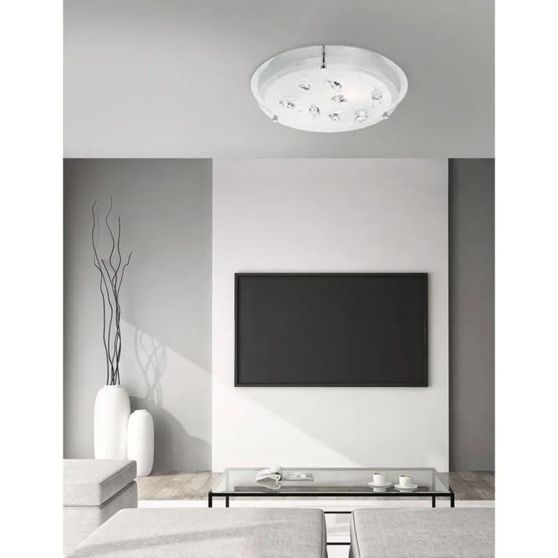Vedere Kristall-Deckenlampe Chrom Glas in modernem Wohnraum mit TV und Glas-Tisch.