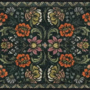 Salonloewe Fußmatte mit symmetrischem Blumenmuster auf dunkelgrünem Hintergrund