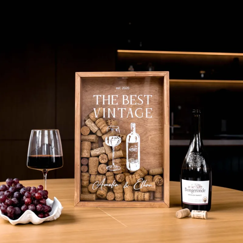 A personalized wooden wine-themed framed print on a wooden table