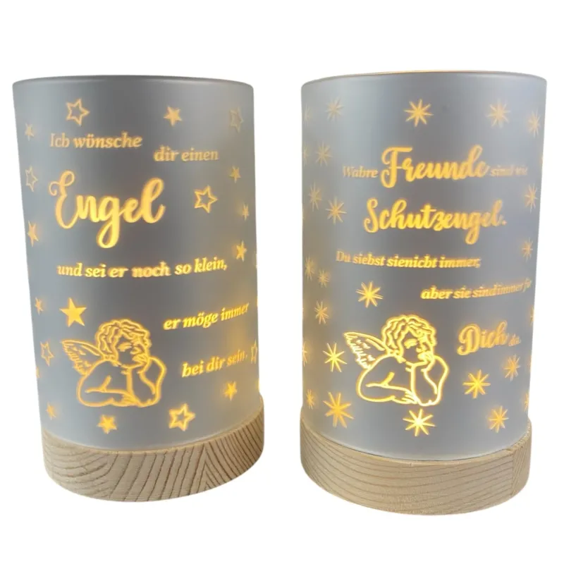 Zwei graue LED-Dekolicht-Säulen mit silbernem Schriftzug und Engelmotiv auf Holzfuß in verschiedenen Varianten.