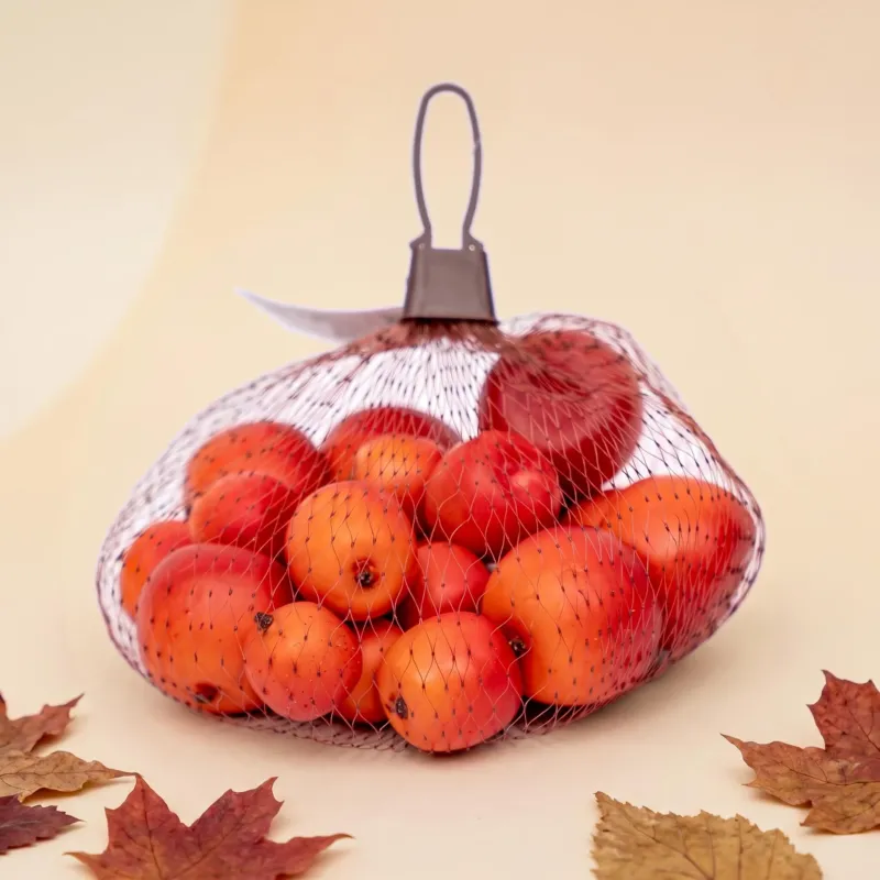 Twenty small foam apples in red and orange, three sizes